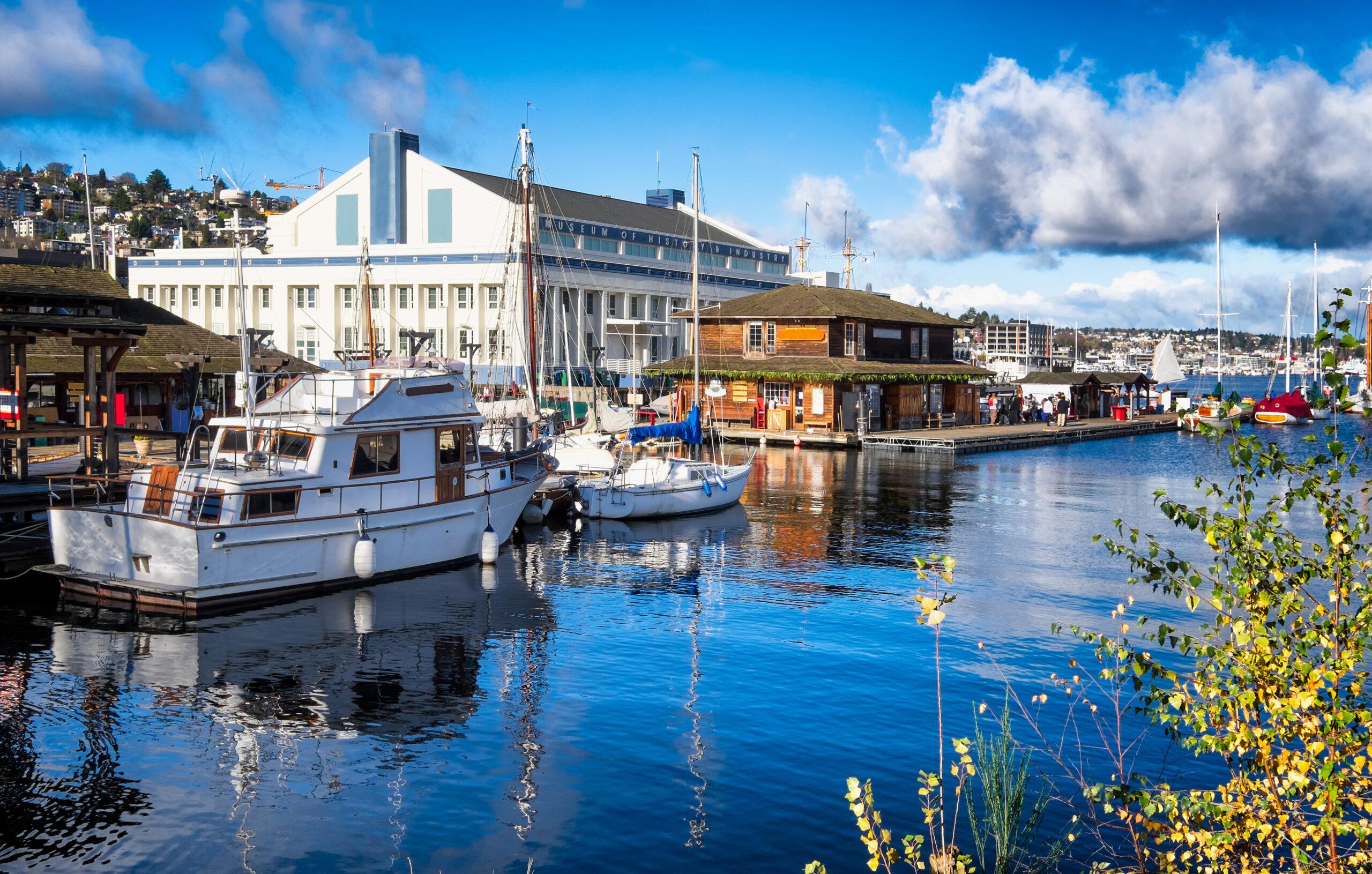 Seattle Lake Union dock with wooden boats and the public museum.
